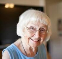 Portrait of senior woman, indoors, smiling